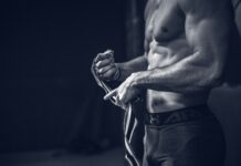 “내게 딱 맞는 근육관리법, 지금 바로 실천하세요” a shirtless man holding a pair of gloves