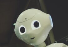 AI와 함께하는 일상 건강관리, 실천 가능한 새로운 변화 white robot toy holding black tablet